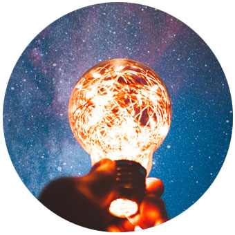Light bulb held in sky - Light Therapy for Physical and Mental Health - London Herts Essex - Lucia No3